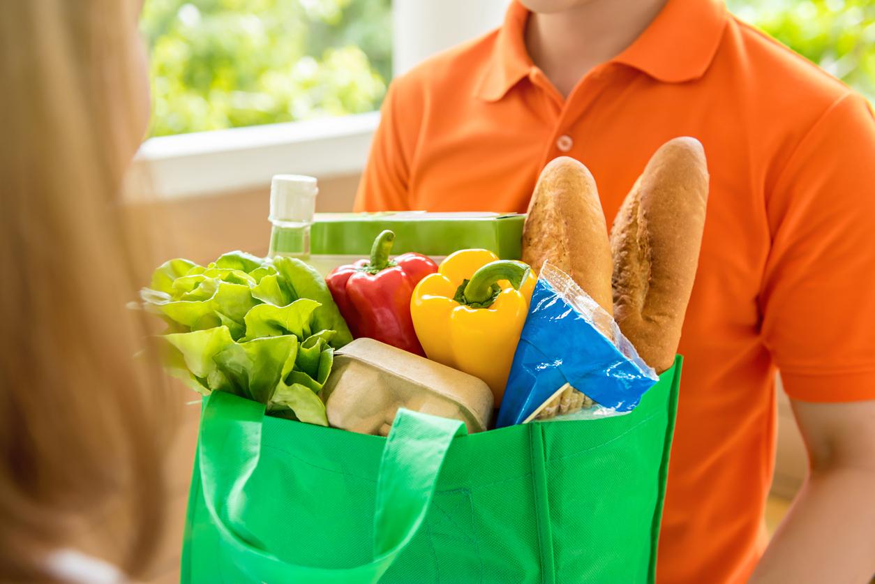 Photo of a grocery Bag hand-off 
